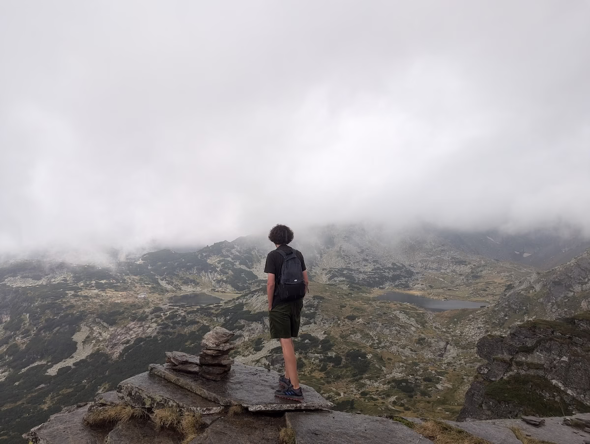 Backpack travel at the Seven Rila Lakes in Bulgaria during a sudden storm